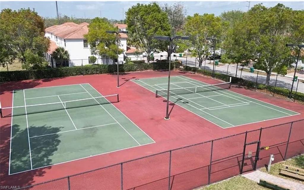 14712 Sutherland Avenue Naples, FL 34119 - Photo 8 of 8 a tennis court view