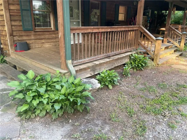 a view of a chair with a small yard