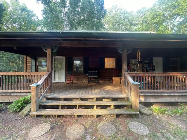 a view of a balcony with two chairs and a table