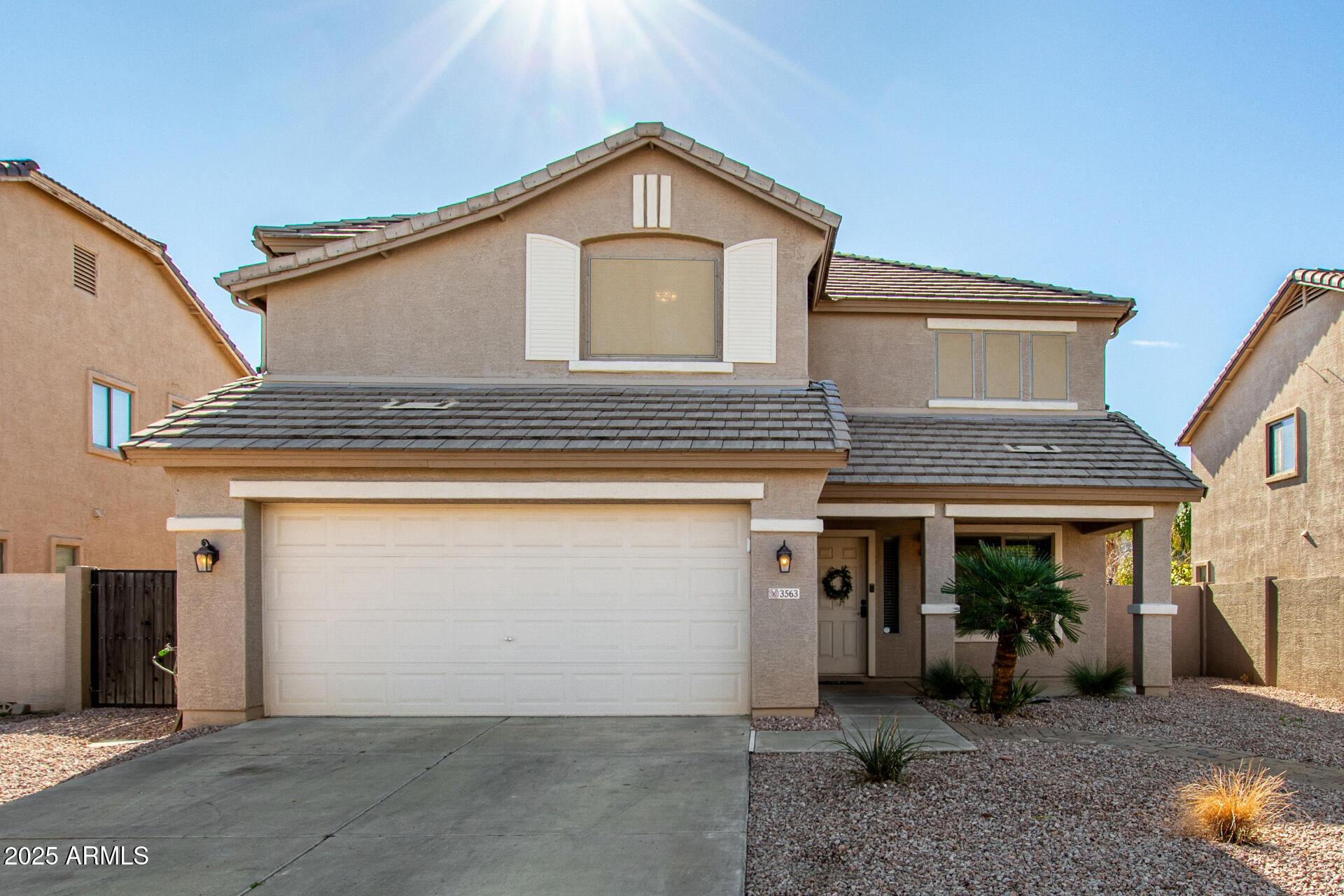 3563 East Blue Ridge Way Gilbert, AZ 85298 - Photo 2 of 48 a view of a house with a garage and balcony
