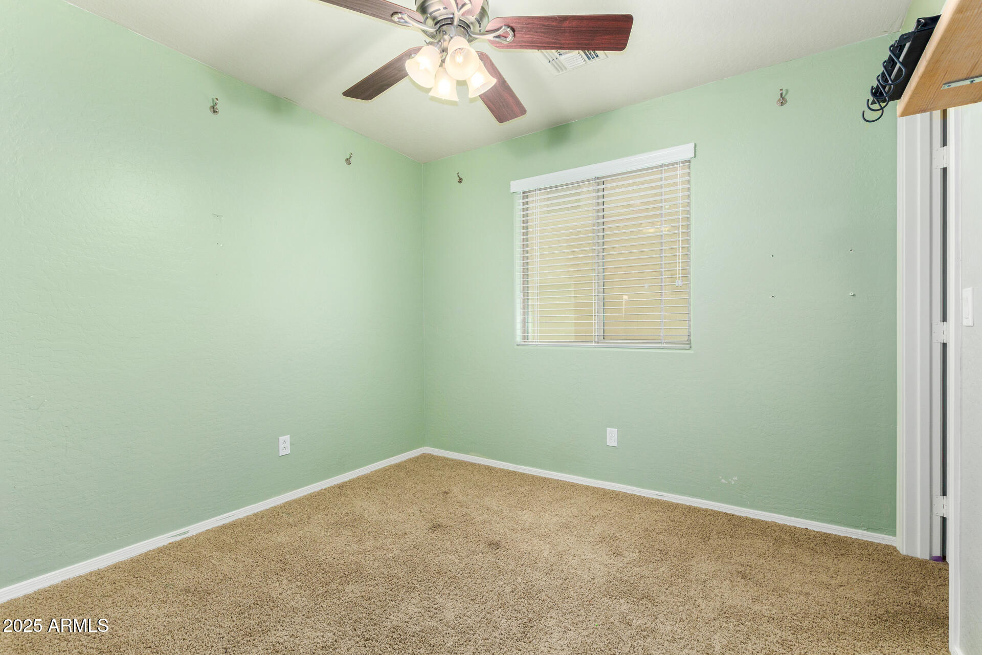 3563 East Blue Ridge Way Gilbert, AZ 85298 - Photo 26 of 48 an empty room with a window and a fan