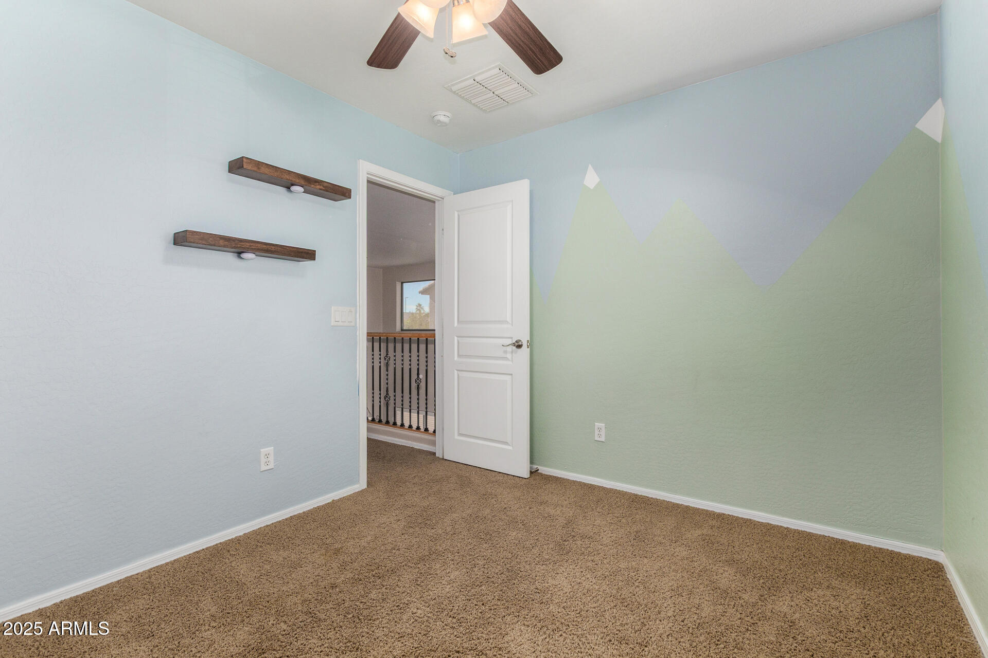 3563 East Blue Ridge Way Gilbert, AZ 85298 - Photo 29 of 48 an empty room with closet and a ceiling fan