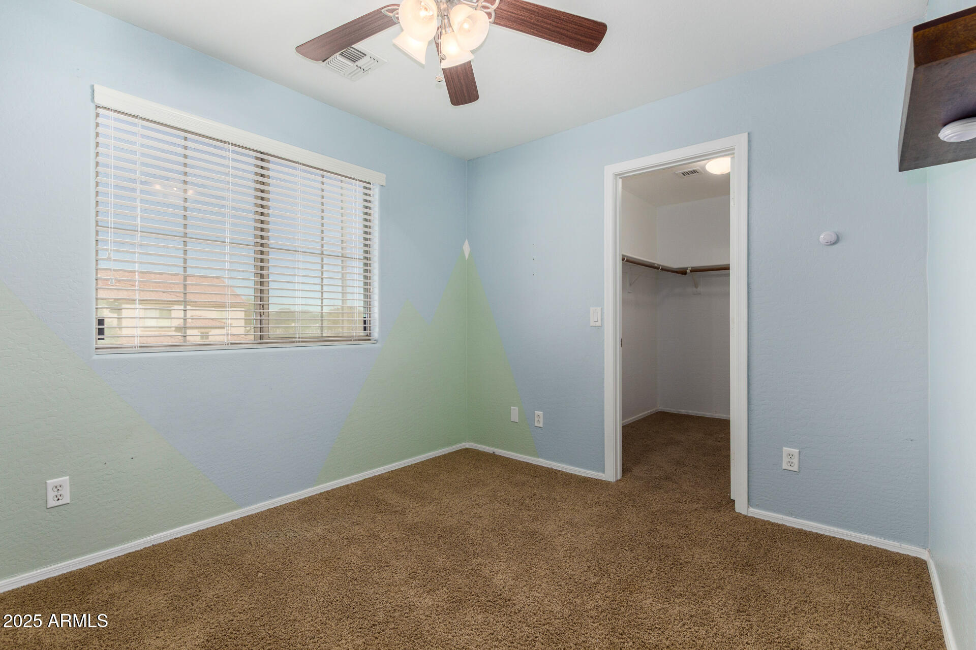 3563 East Blue Ridge Way Gilbert, AZ 85298 - Photo 30 of 48 an empty room with chandelier fan and windows