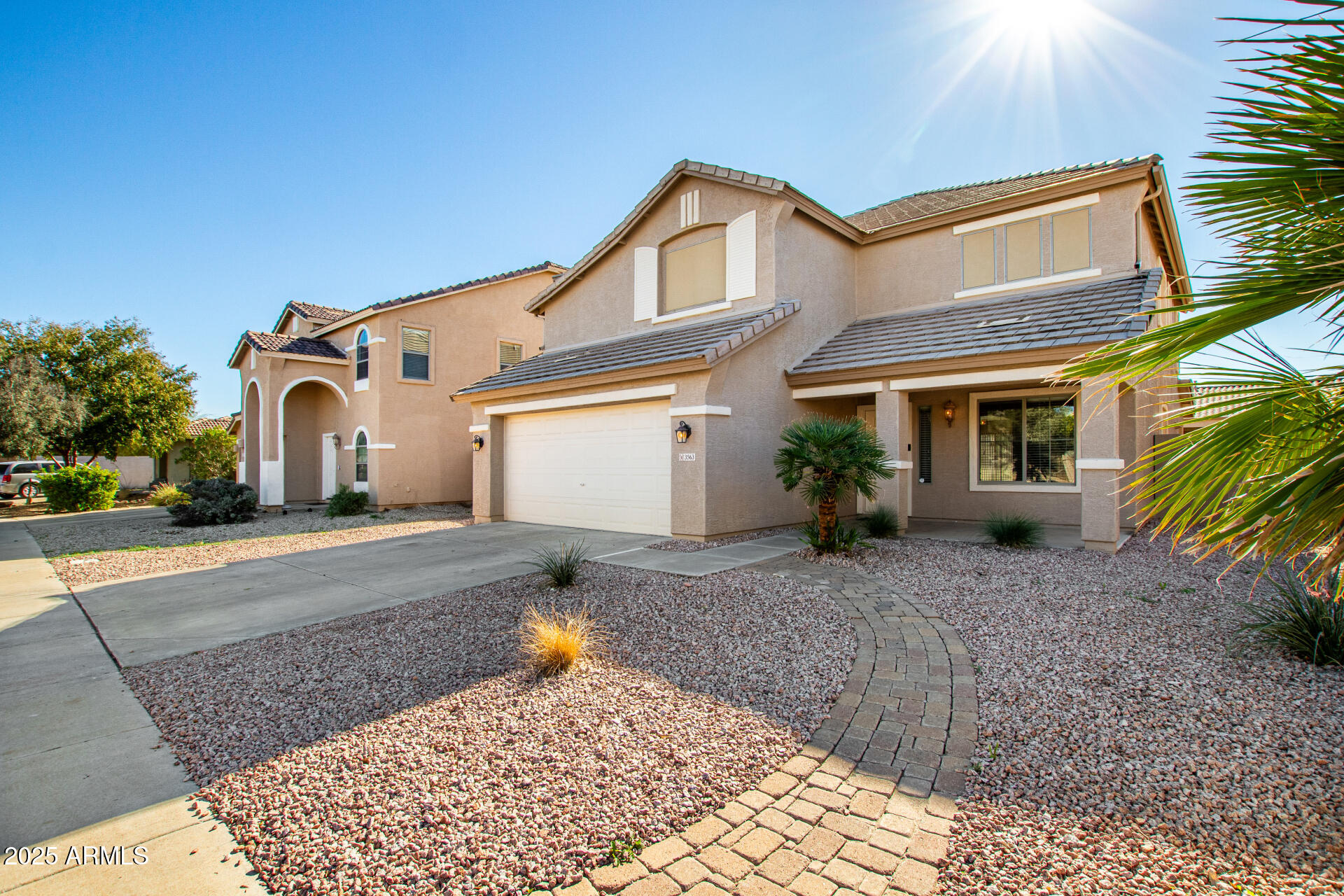3563 East Blue Ridge Way Gilbert, AZ 85298 - Photo 3 of 48 a front view of a house with a yard and potted plants
