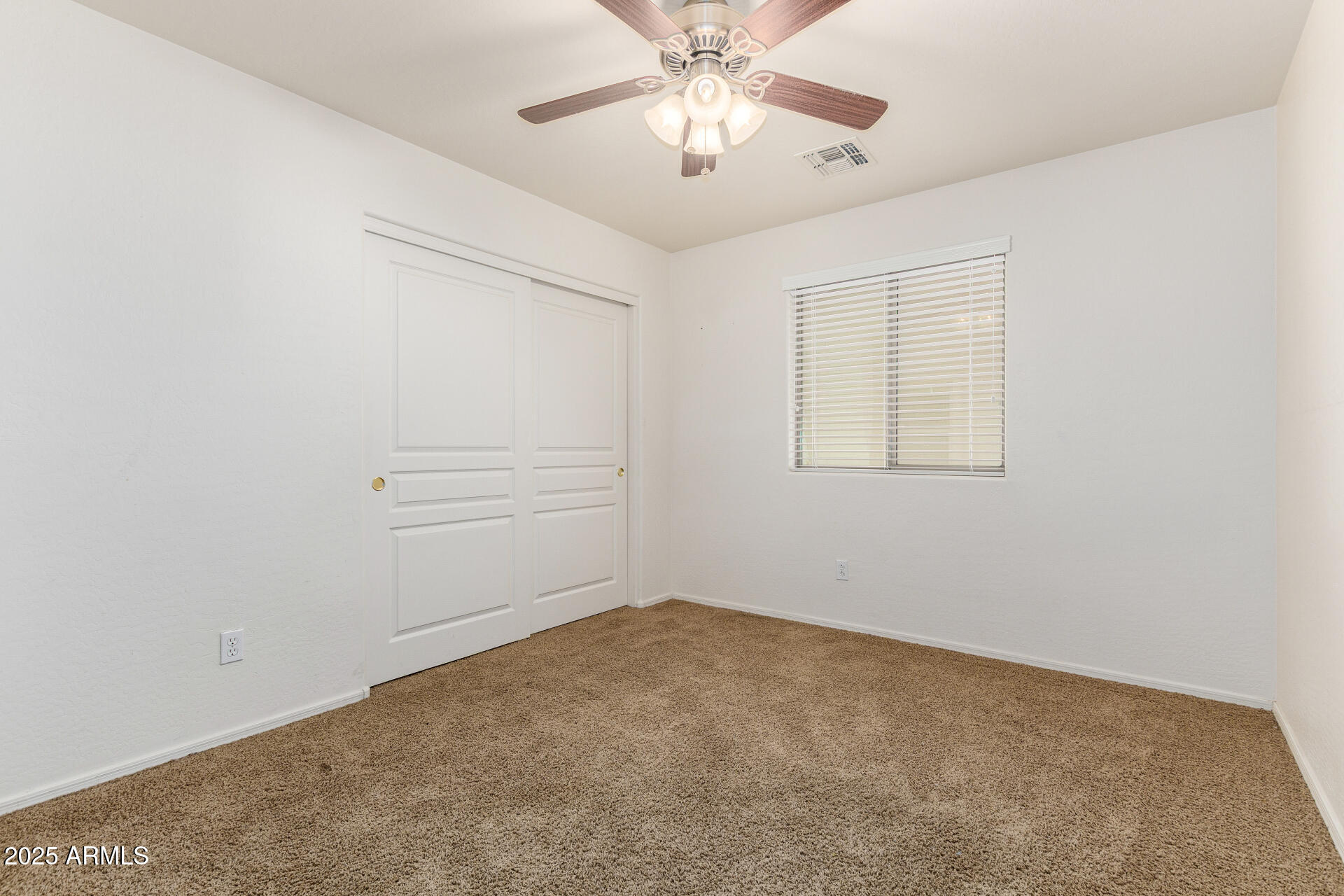 3563 East Blue Ridge Way Gilbert, AZ 85298 - Photo 34 of 48 an empty room with chandelier fan