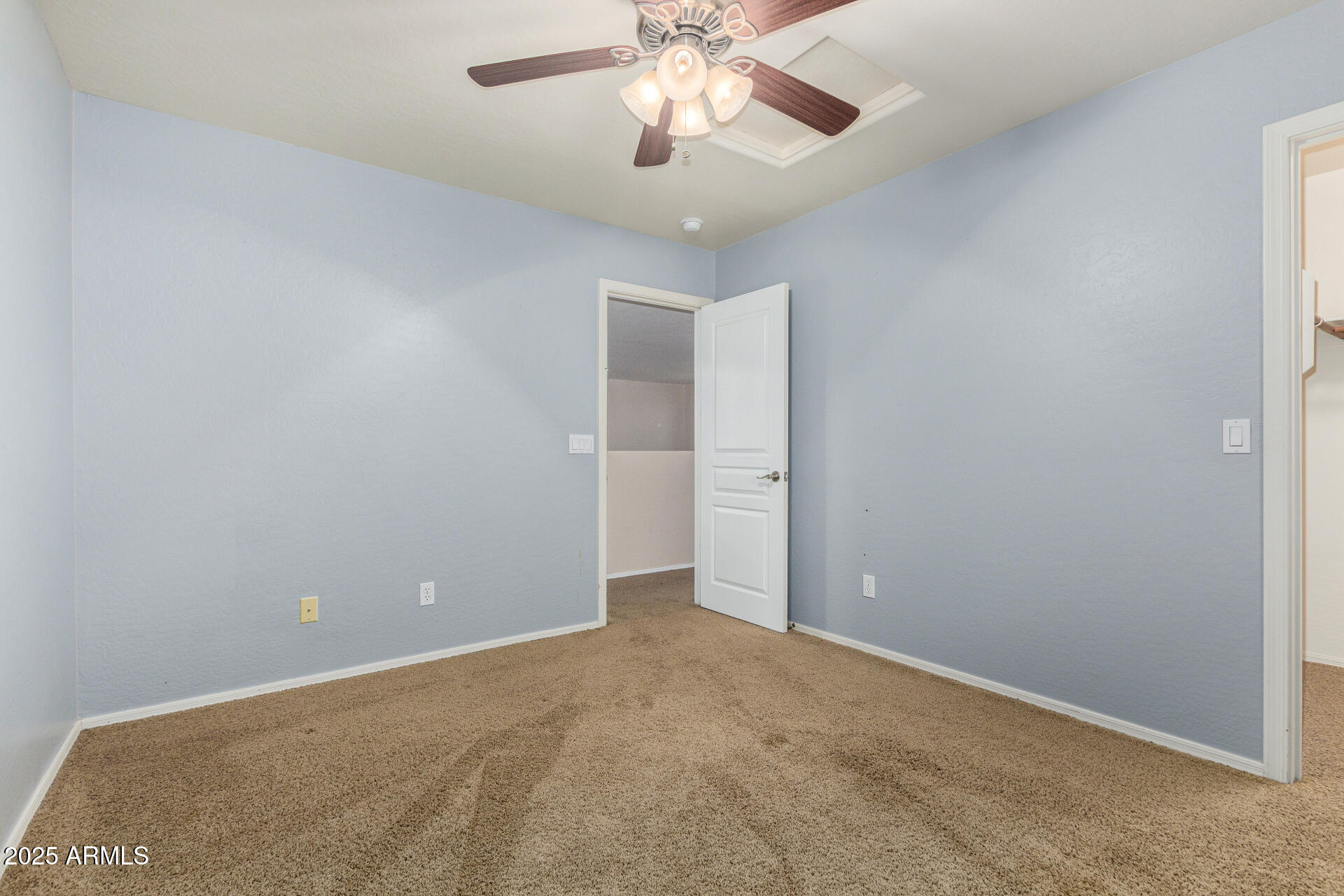 3563 East Blue Ridge Way Gilbert, AZ 85298 - Photo 36 of 48 a view of an empty room and chandelier fan