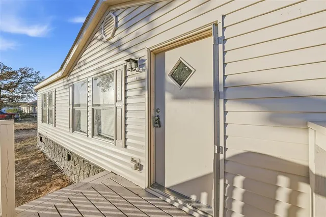 a view of a house with a street