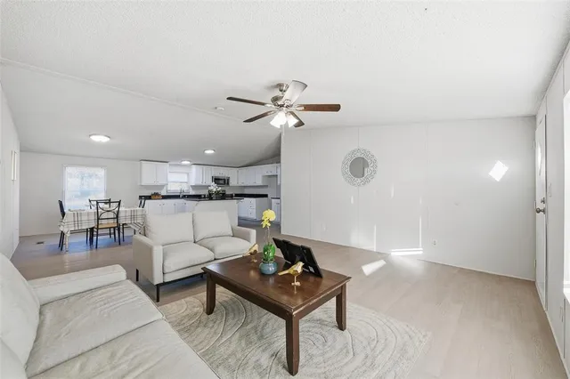 a living room with furniture and a table