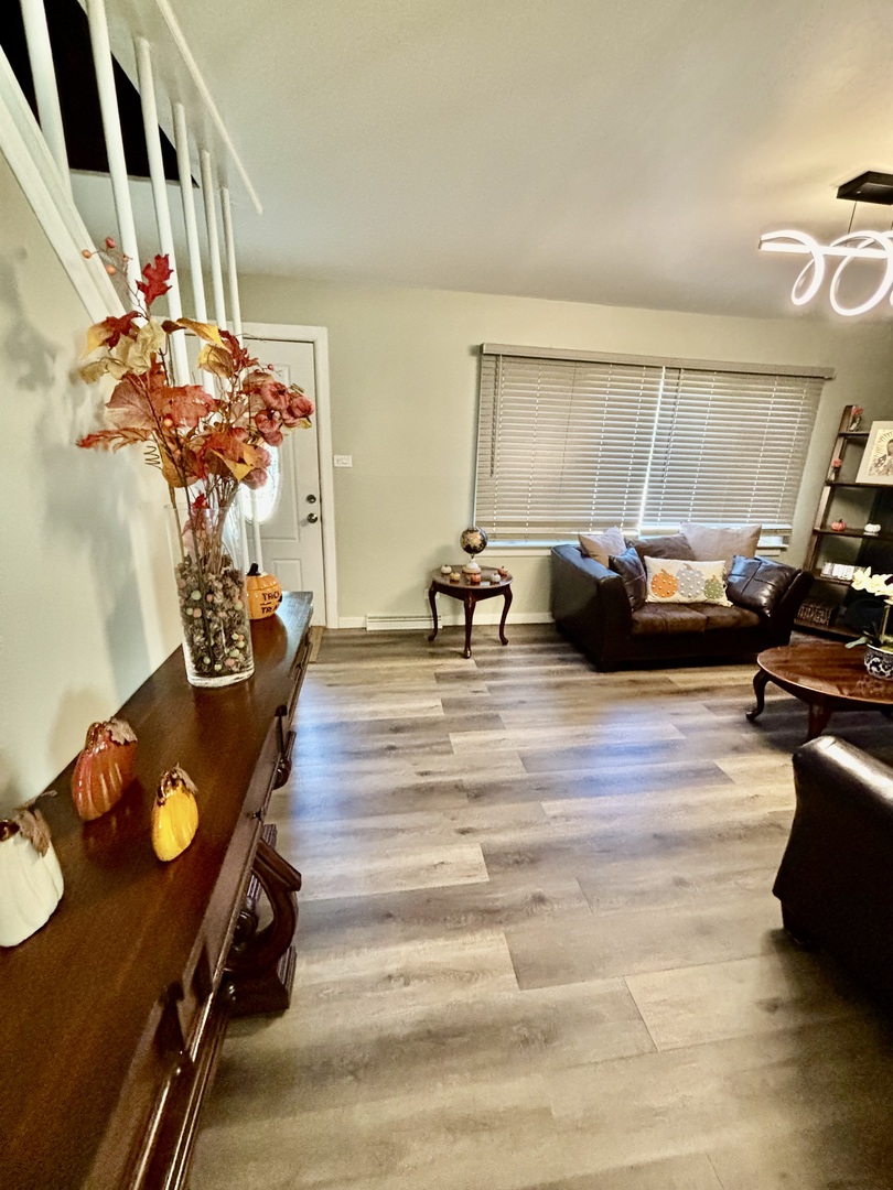 6737 104th Place Chicago Ridge, IL 60415 - Photo 11 of 32 a living room with furniture and a window