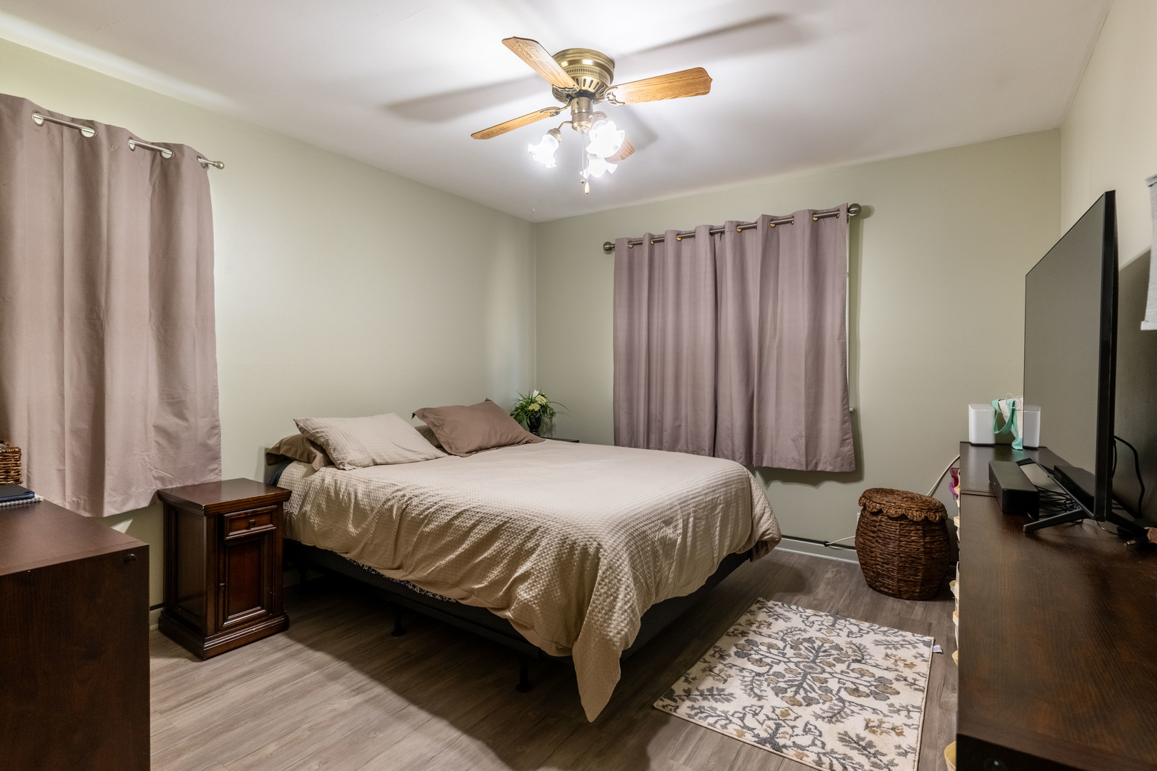 6737 104th Place Chicago Ridge, IL 60415 - Photo 12 of 32 a bedroom with a bed tv and a window