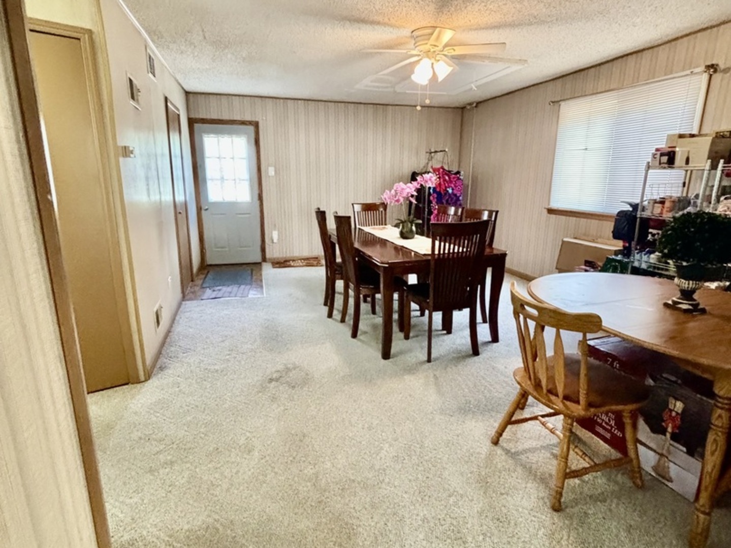 6737 104th Place Chicago Ridge, IL 60415 - Photo 20 of 32 a view of a dining room with furniture and a chandelier fan