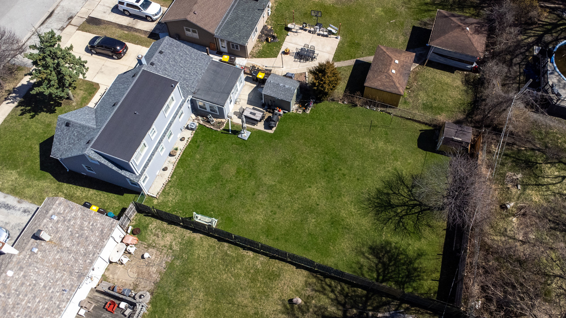 6737 104th Place Chicago Ridge, IL 60415 - Photo 23 of 32 an aerial view of a house with a garden and swimming pool