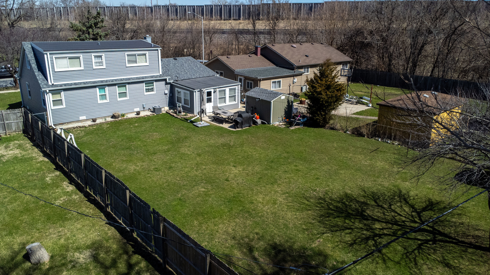 6737 104th Place Chicago Ridge, IL 60415 - Photo 24 of 32 a aerial view of a house with a yard table and chairs