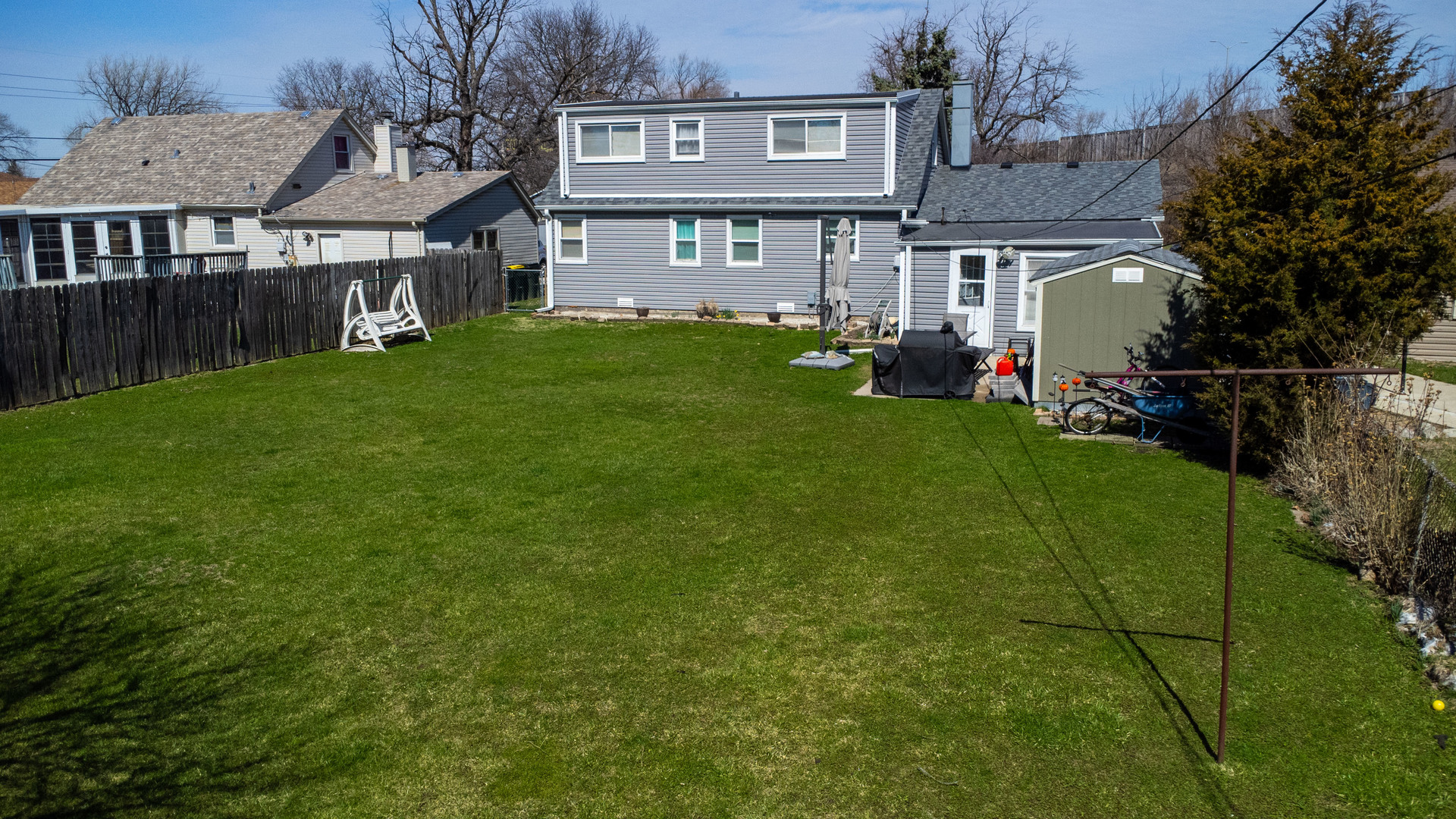 6737 104th Place Chicago Ridge, IL 60415 - Photo 25 of 32 a view of a house with backyard and a tree