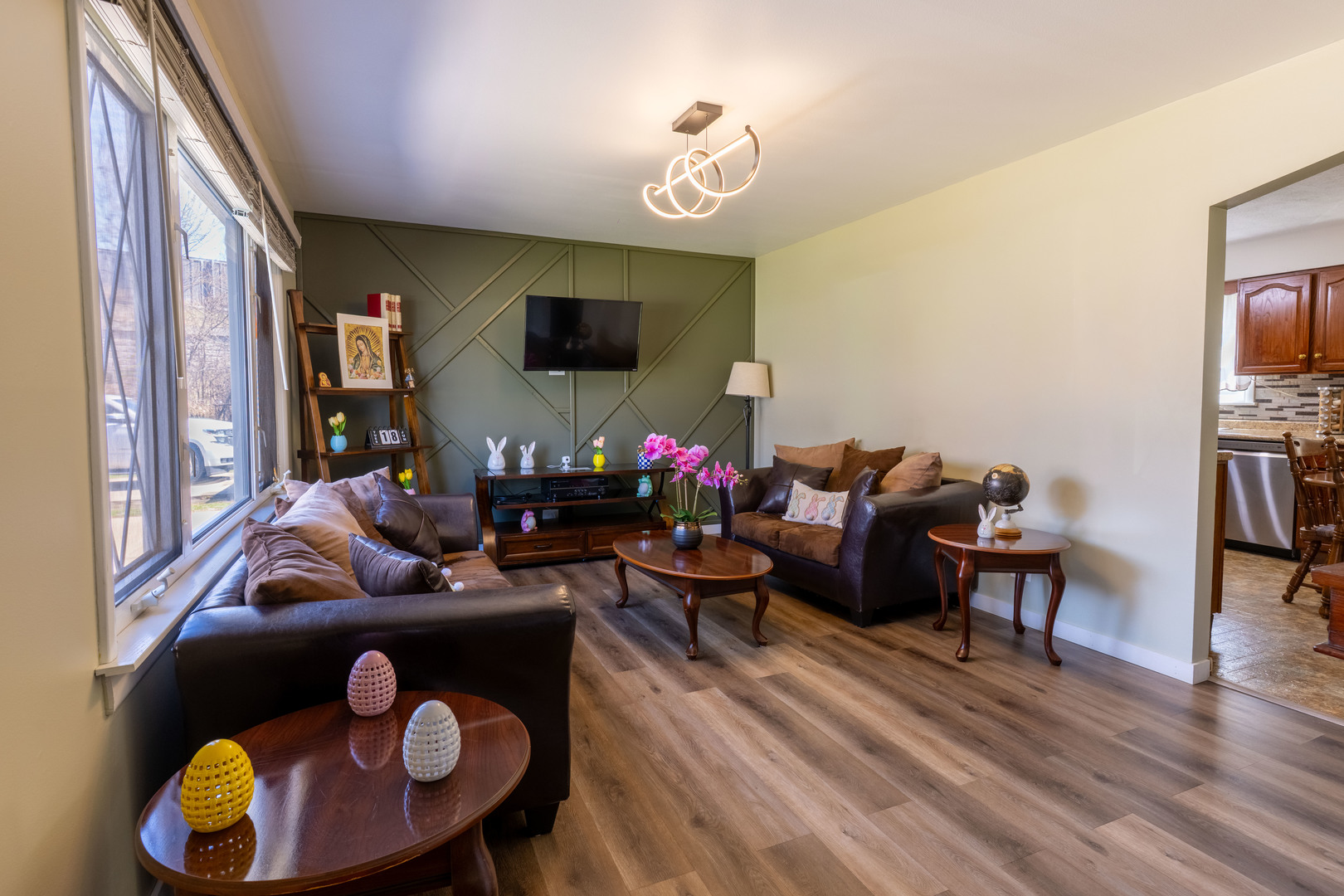 6737 104th Place Chicago Ridge, IL 60415 - Photo 8 of 32 a living room with furniture and a flat screen tv