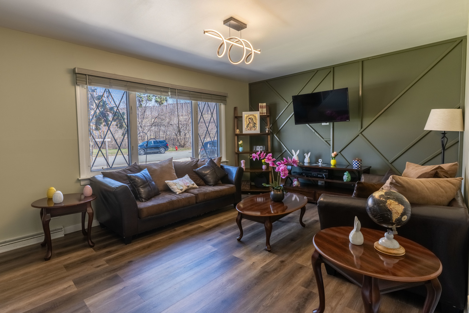6737 104th Place Chicago Ridge, IL 60415 - Photo 10 of 32 a living room with furniture a flat screen tv and a window