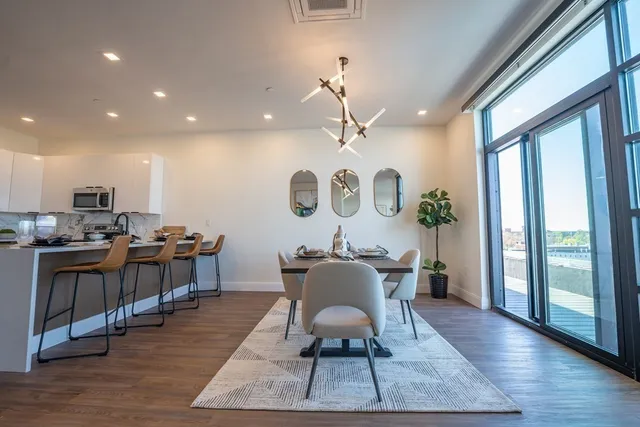 a view of a dining room with furniture window and wooden floor