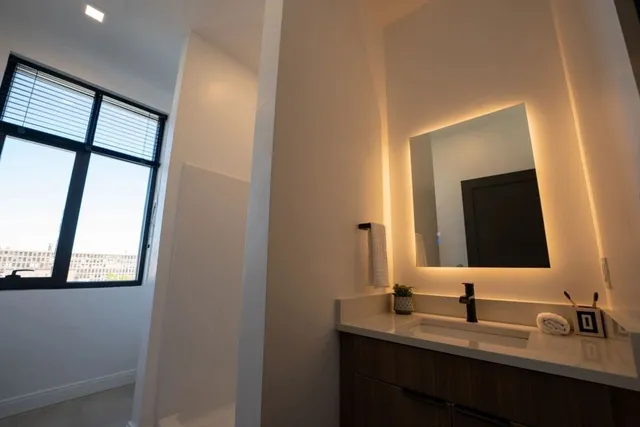 a bathroom with a sink and a mirror