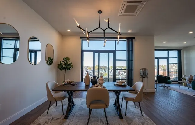 a view of a dining room with furniture window and wooden floor