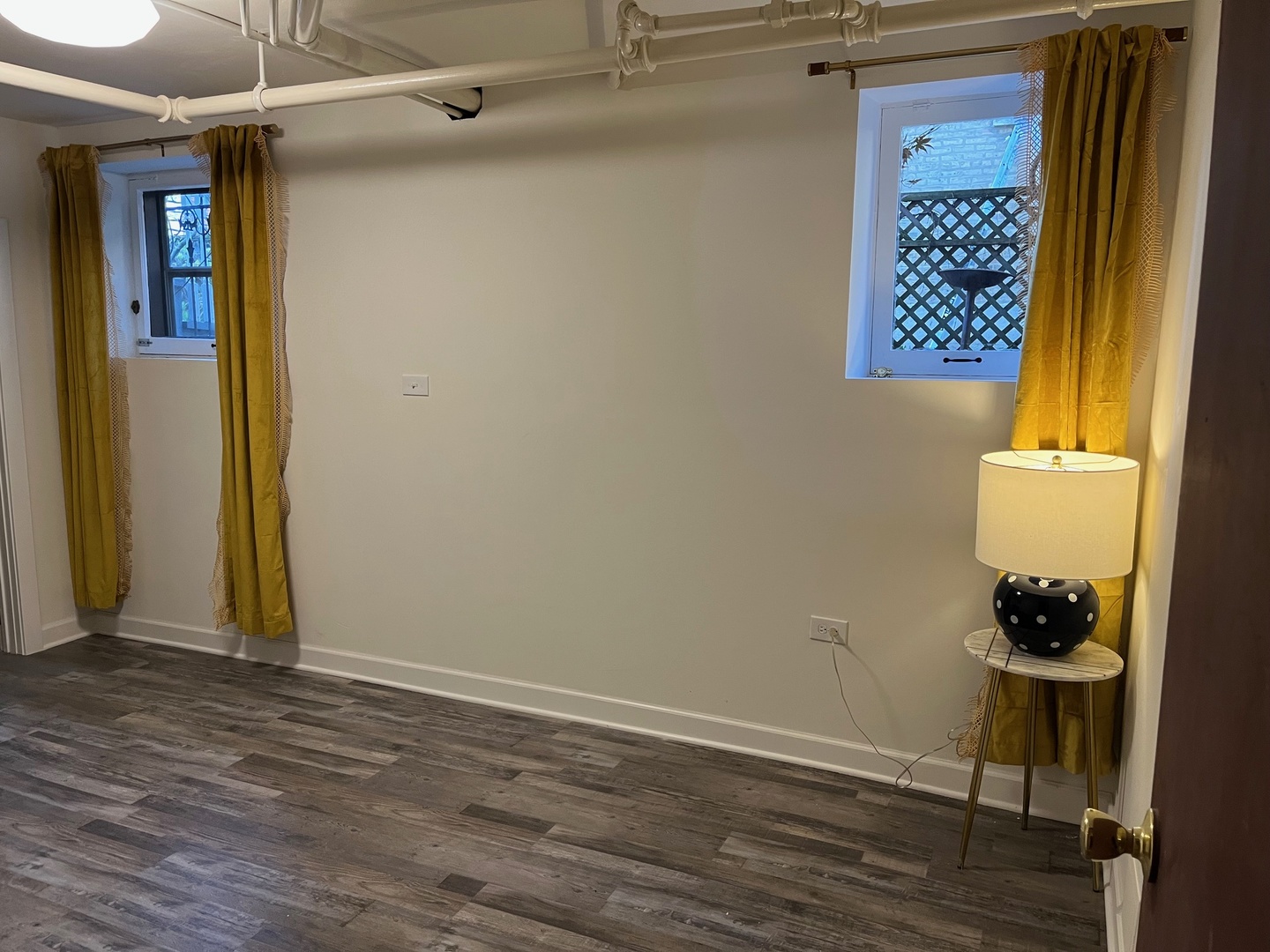 622 West Briar Place, Unit G Chicago, IL 60657 - Photo 13 of 19 a room with a door and wooden floor