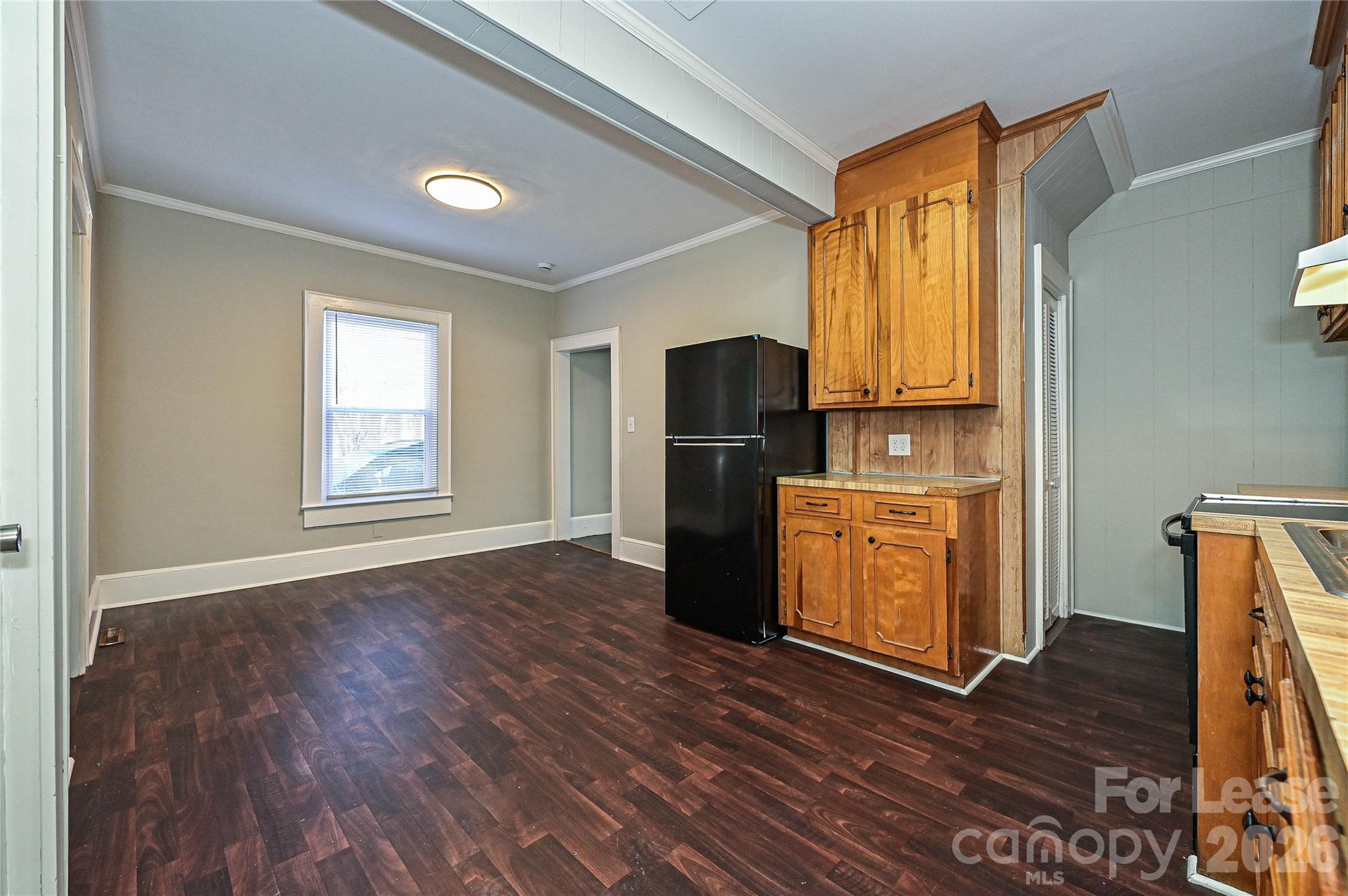 134 Saluda Street, Unit B Chester, SC 29706 - Photo 11 of 21 a kitchen with stainless steel appliances a refrigerator and wooden floor