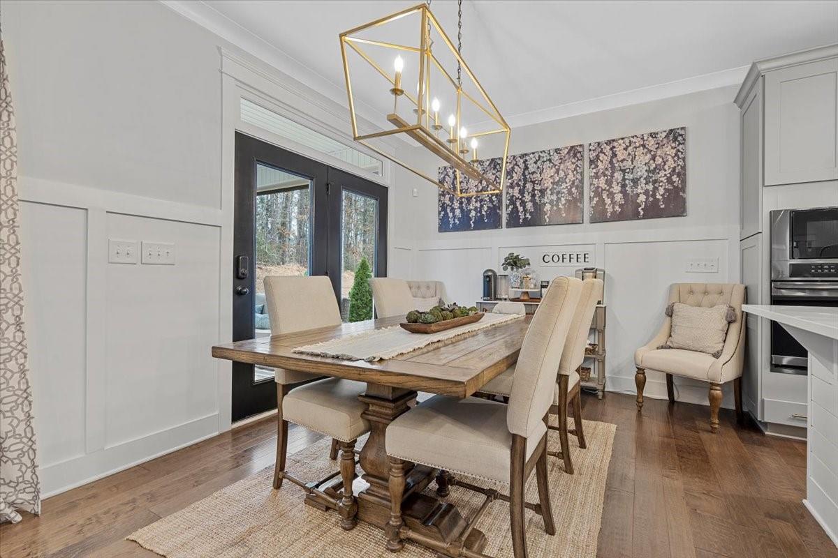1112 Baldwin Drive Lancaster, SC 29720 - Photo 11 of 48 a view of a dining room with furniture window and wooden floor