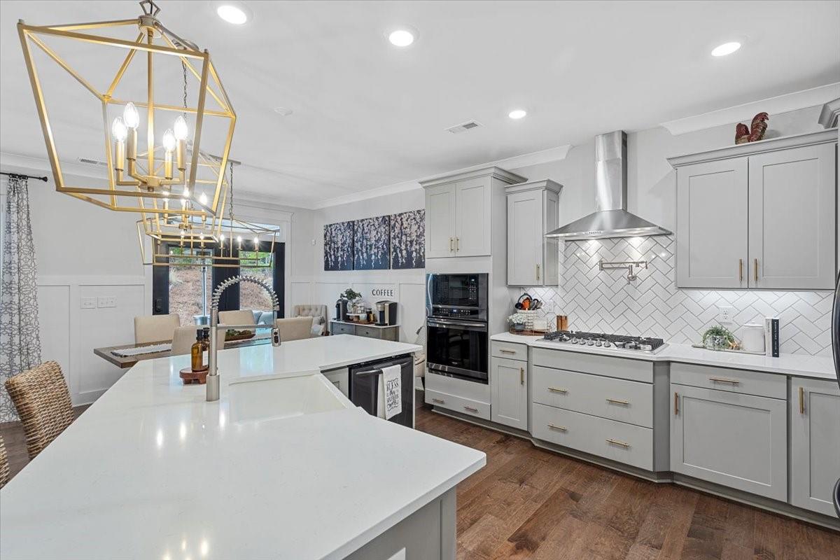 1112 Baldwin Drive Lancaster, SC 29720 - Photo 14 of 48 a kitchen with stainless steel appliances a sink stove and cabinets