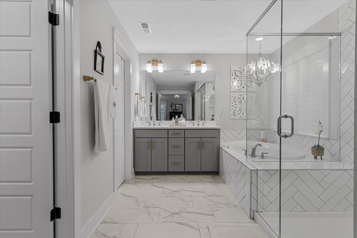 1112 Baldwin Drive Lancaster, SC 29720 - Photo 25 of 48 a spacious bathroom with a sink a mirror and a shower