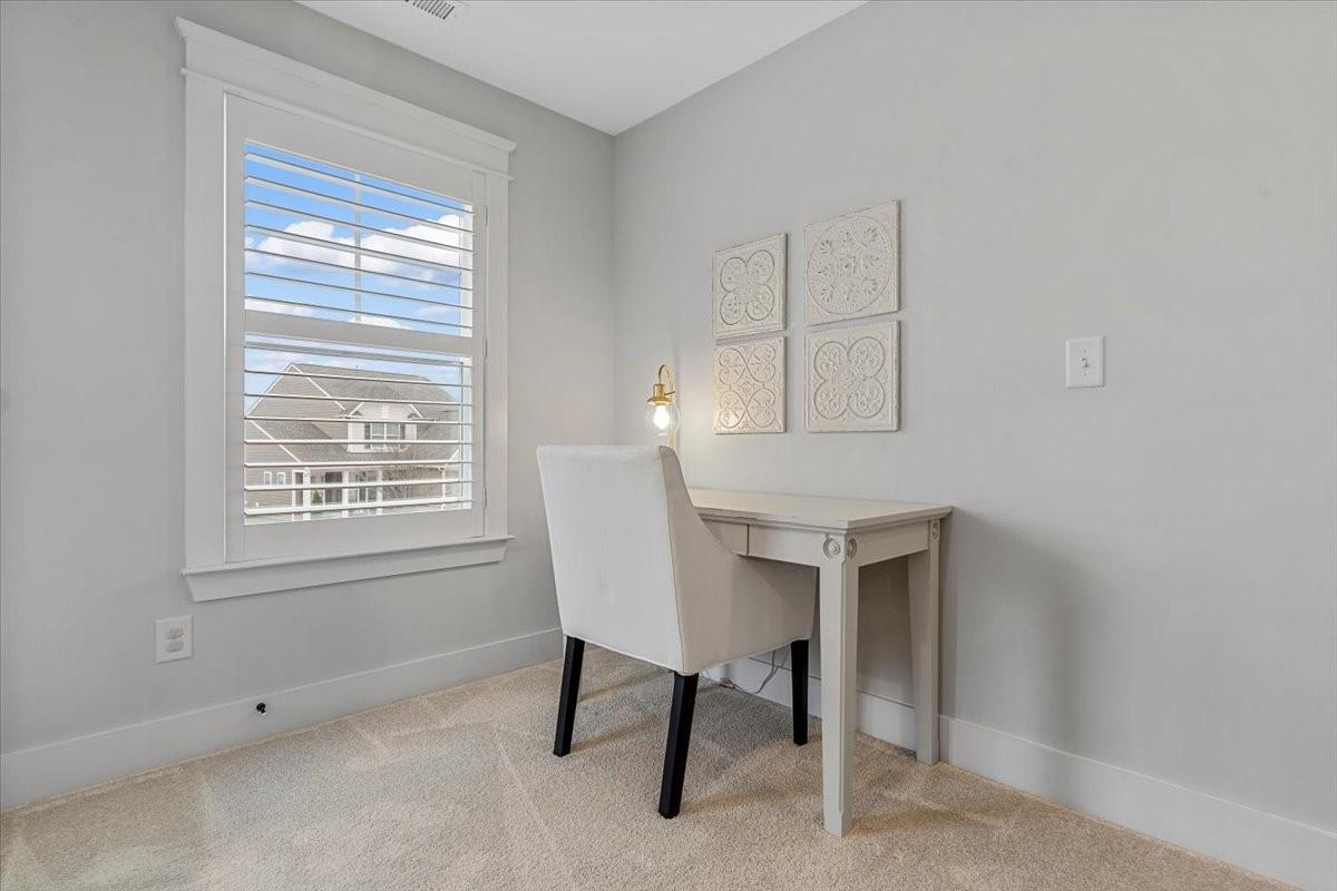 1112 Baldwin Drive Lancaster, SC 29720 - Photo 36 of 48 a view of a workspace with furniture and a window