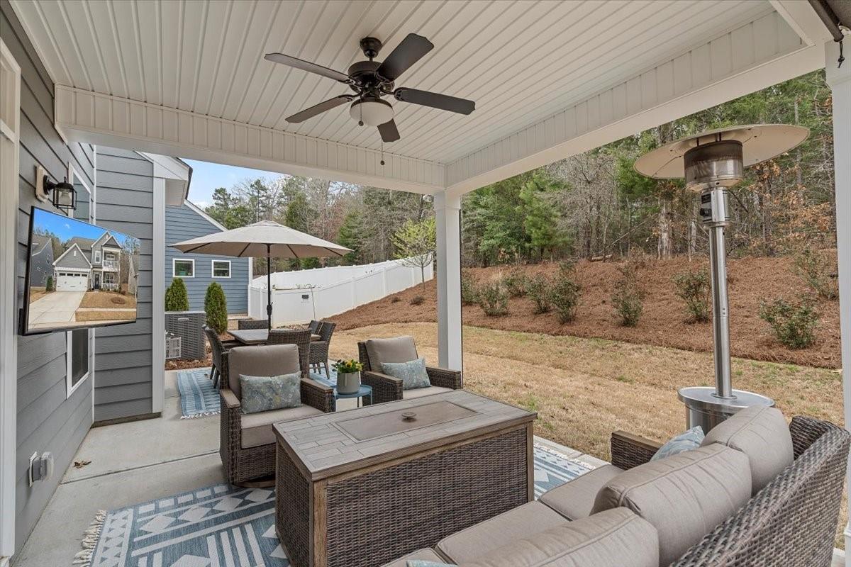 1112 Baldwin Drive Lancaster, SC 29720 - Photo 43 of 48 a living room with furniture a ceiling fan and a large window