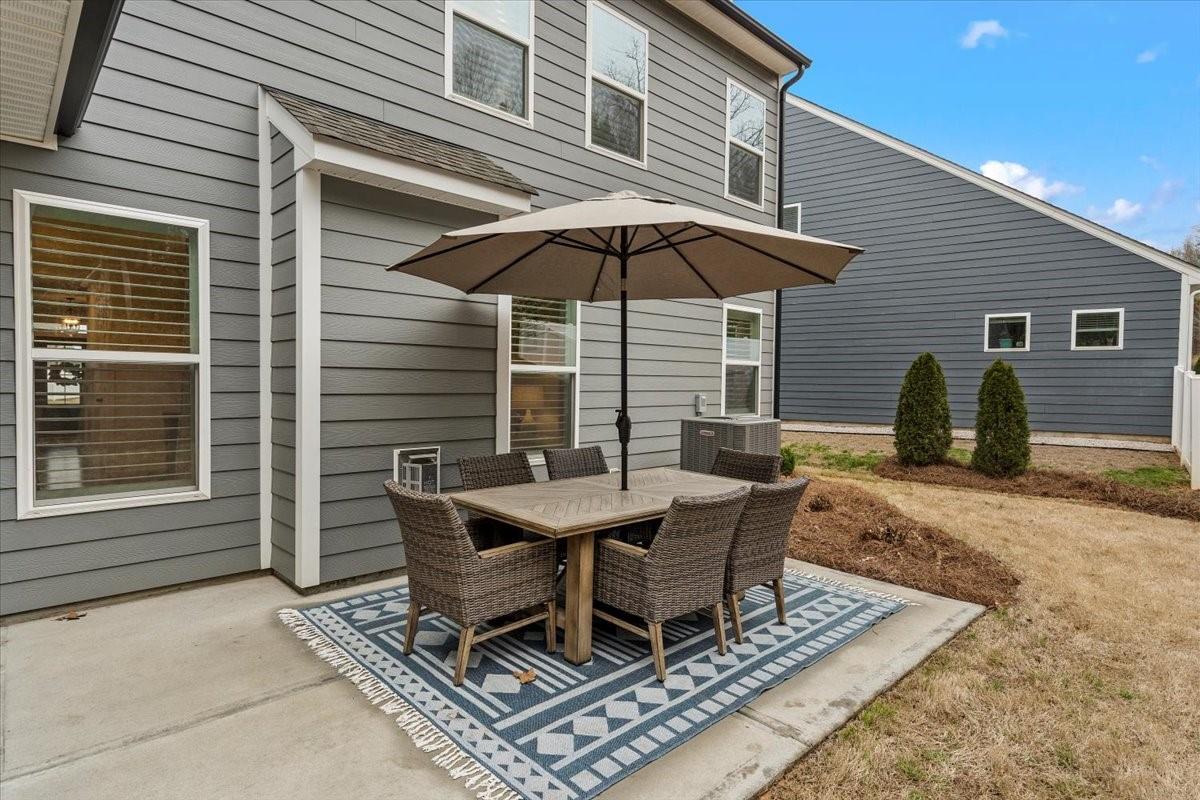 1112 Baldwin Drive Lancaster, SC 29720 - Photo 46 of 48 a backyard of a house with table and chairs