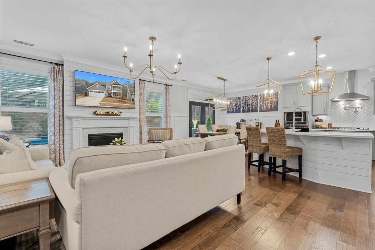 1112 Baldwin Drive Lancaster, SC 29720 - Photo 8 of 48 a living room with furniture a table and kitchen view