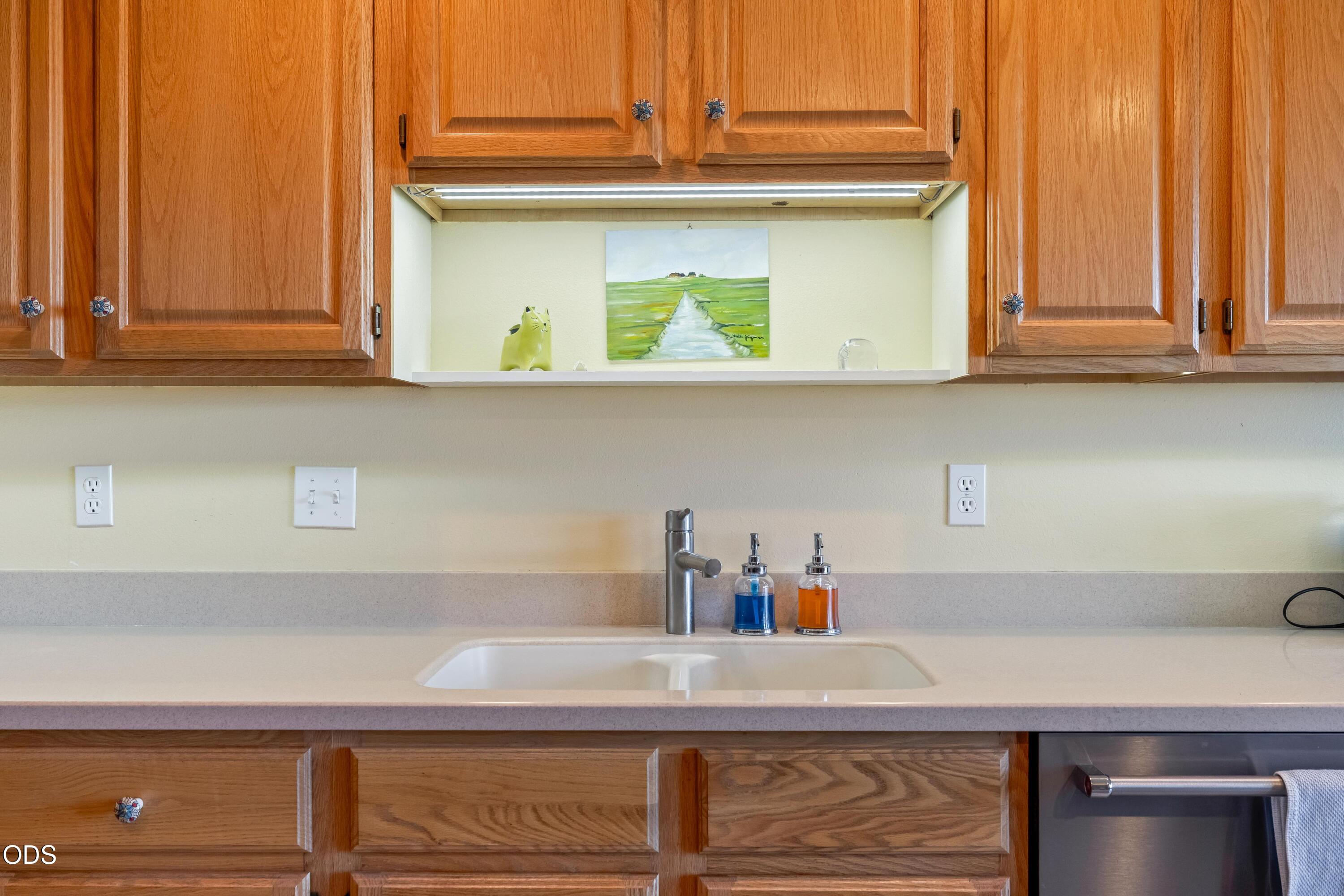 13753 South Sego Lily Road Powell Butte, OR 97753 - Photo 8 of 46 a kitchen with a sink and cabinets