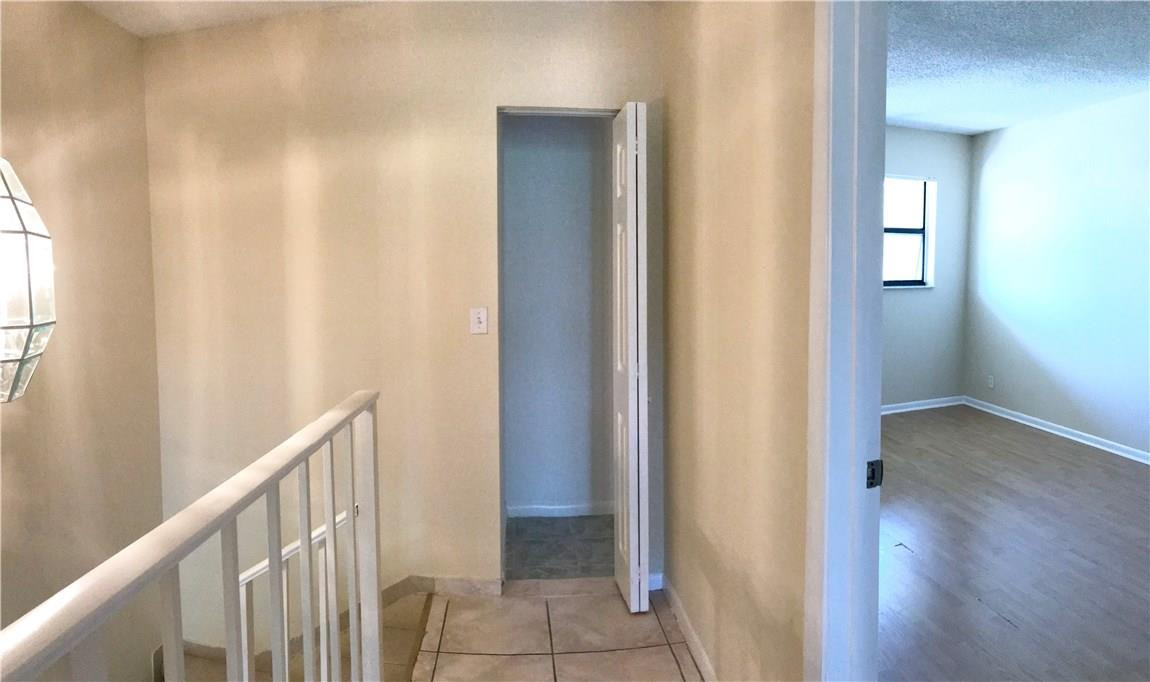 22435 Southwest 61st Way, Unit B124 Boca Raton, FL 33428 - Photo 11 of 35 a view of a hallway with wooden floor and entryway