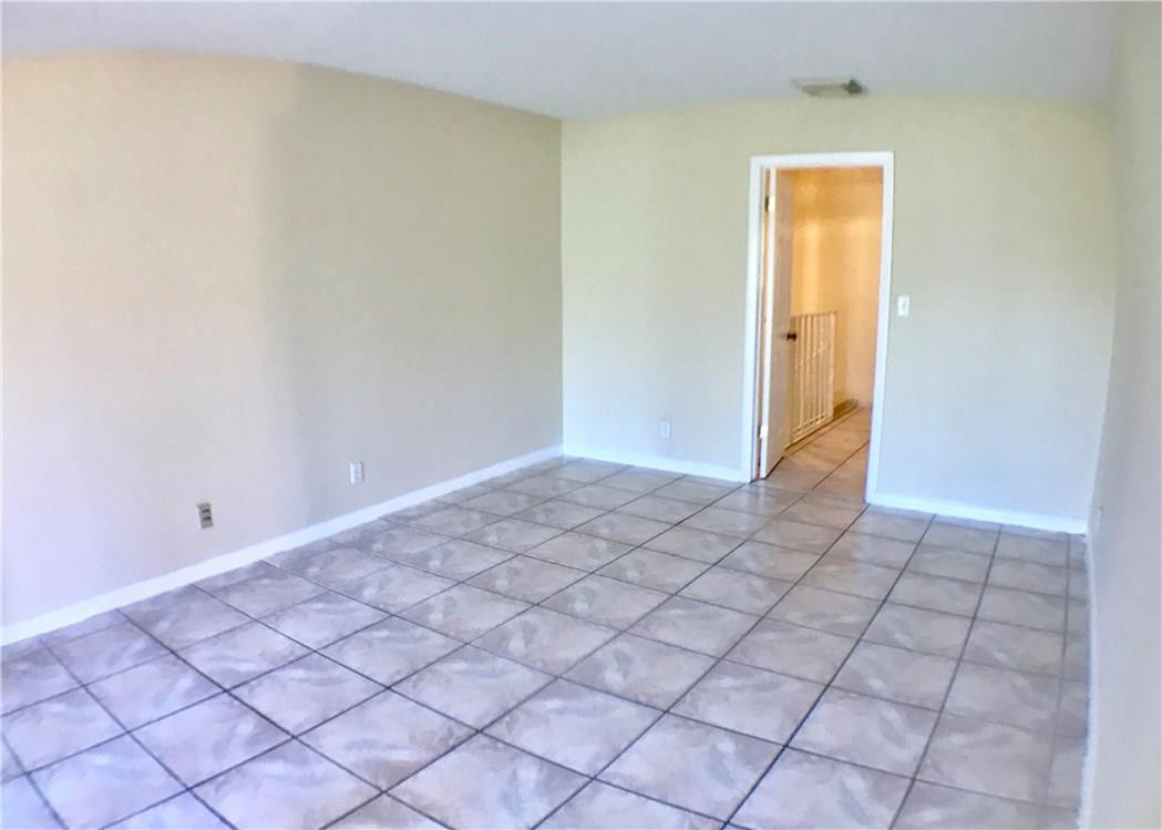 22435 Southwest 61st Way, Unit B124 Boca Raton, FL 33428 - Photo 13 of 35 a view of an empty room and window