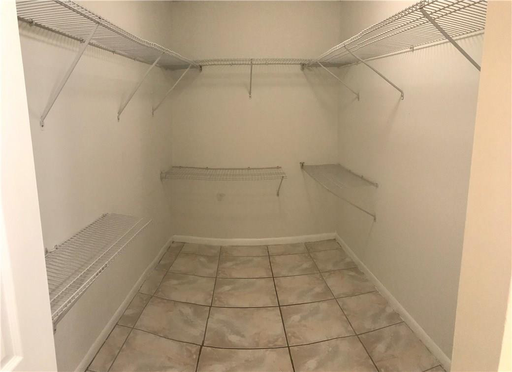 22435 Southwest 61st Way, Unit B124 Boca Raton, FL 33428 - Photo 14 of 35 a view of a room with racks on the wall