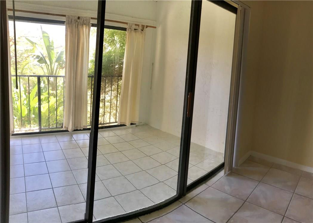 22435 Southwest 61st Way, Unit B124 Boca Raton, FL 33428 - Photo 15 of 35 a view of an empty room and window