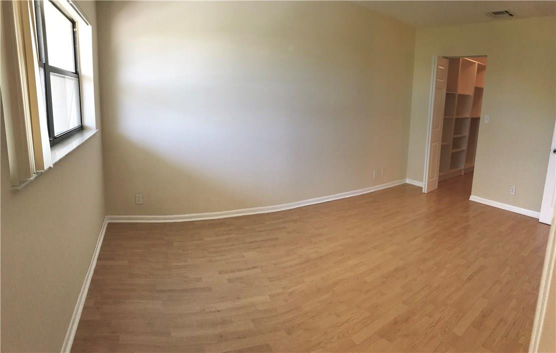 22435 Southwest 61st Way, Unit B124 Boca Raton, FL 33428 - Photo 19 of 35 an empty room with windows