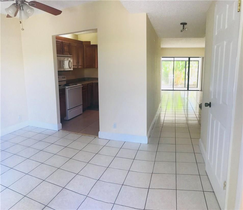 22435 Southwest 61st Way, Unit B124 Boca Raton, FL 33428 - Photo 2 of 35 an empty room with windows
