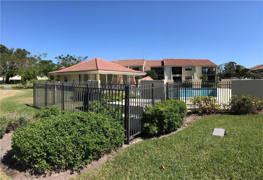 22435 Southwest 61st Way, Unit B124 Boca Raton, FL 33428 - Photo 26 of 35 a front view of a house with a garden