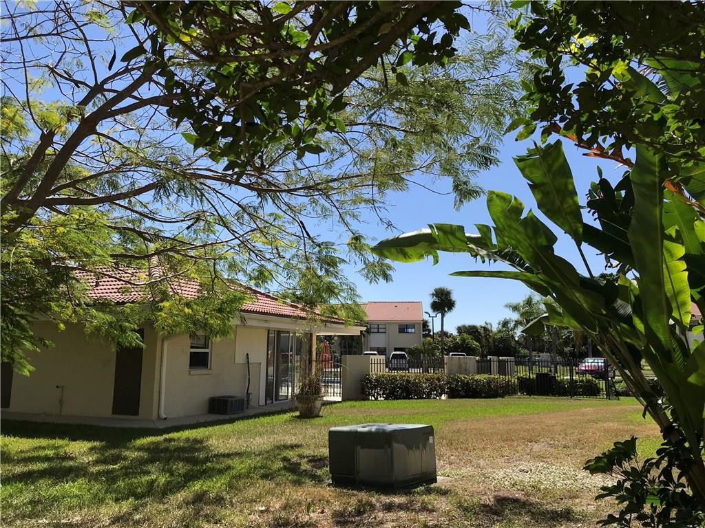 22435 Southwest 61st Way, Unit B124 Boca Raton, FL 33428 - Photo 28 of 35 a view of a house with a yard