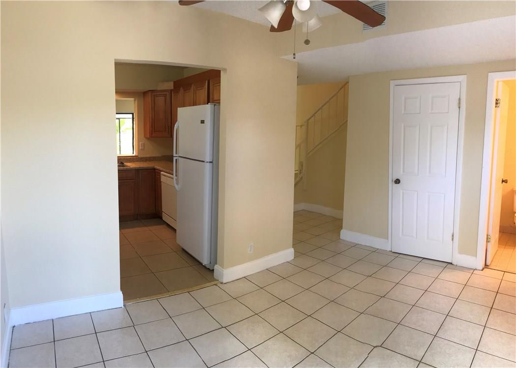 22435 Southwest 61st Way, Unit B124 Boca Raton, FL 33428 - Photo 3 of 35 an empty room with closet and a chandelier fan