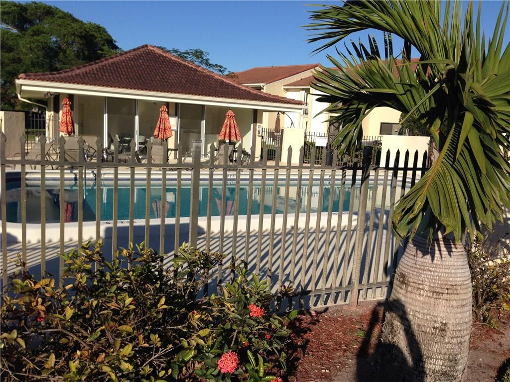 22435 Southwest 61st Way, Unit B124 Boca Raton, FL 33428 - Photo 33 of 35 a view of a house with a flower garden