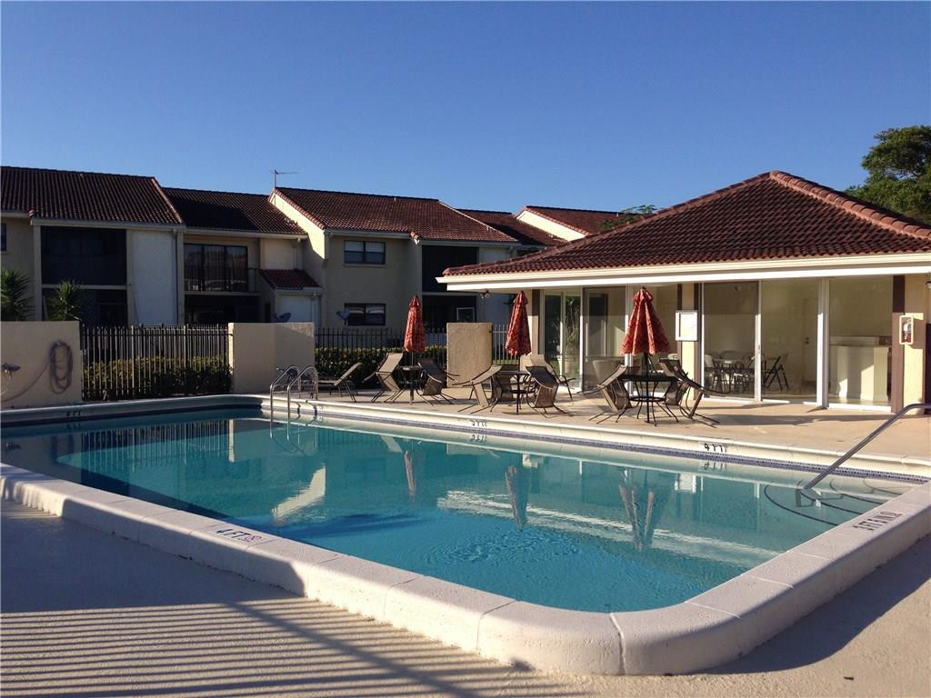 22435 Southwest 61st Way, Unit B124 Boca Raton, FL 33428 - Photo 34 of 35 a view of swimming pool with outdoor seating