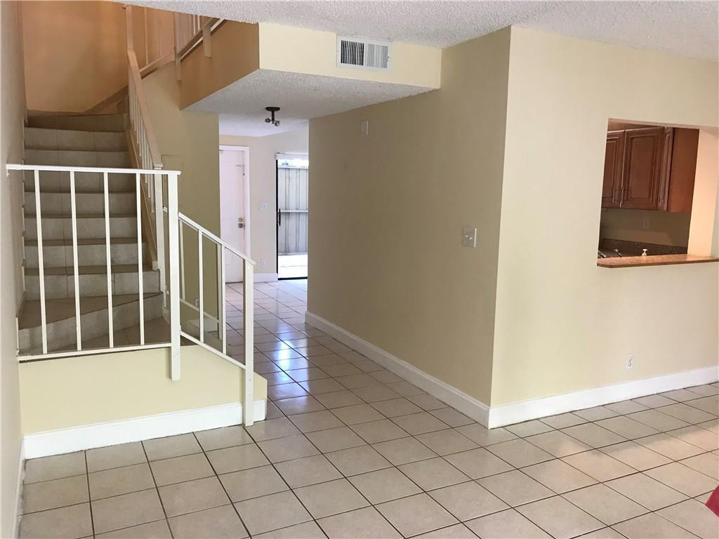 22435 Southwest 61st Way, Unit B124 Boca Raton, FL 33428 - Photo 7 of 35 a view of an empty room with wooden floor