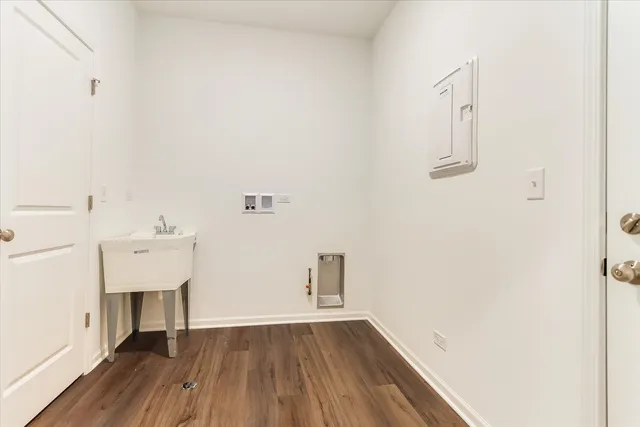 a view of a room with wooden floor