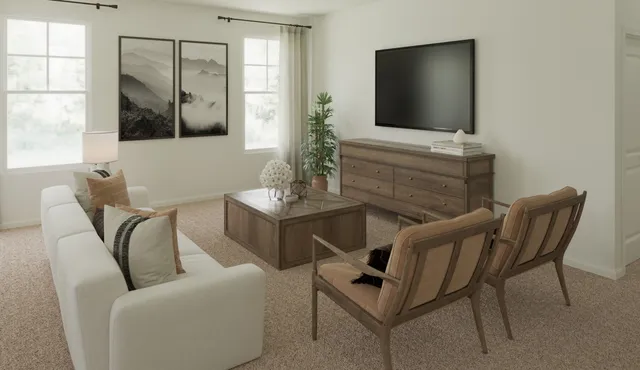 a living room with furniture a flat screen tv and a large window