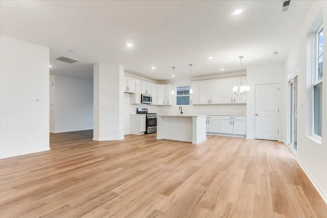 a view of kitchen with wooden floor