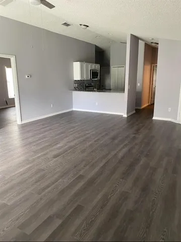 a view of a kitchen with a sink and a stove top oven