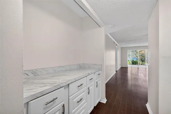 an empty room with wooden floor